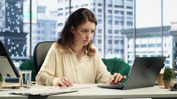 Female leader with executive power signing work contracts and approving employees requests, daily paperwork tasks for productivity. Authorization for leave request or license agreement. Camera A. video