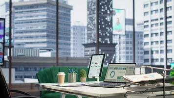 Empty luxurious corporate high end office designed for a CEO or leader, running analytics and data driven insights on screen. Urban global enterprise, business empowerment. Camera B. video