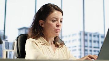 Anxious frustrated entrepreneur having a headache at work, feeling overburdened and uncomfortable with tension and project deadline. Exhausted unwell businesswoman on the job. Camera A. video