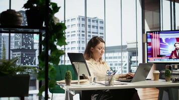 Confident female leader driven by empowerment and ambition, focuses on achieving business targets and enhancing company performance in a dynamic office setting. Leadership success story. Camera B. video