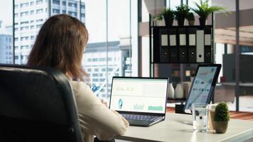 Female entrepreneur working on financial planning and budget allocation, ensuring the company resources are used effectively to achieve maximum profit and long term business objectives. Camera A. video