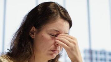 Frustrated sleepy general director suffering form a migraine from workload and fatigue, tired and worried about business activity. Overworked leader deals with burnout and discomfort. Camera A. video