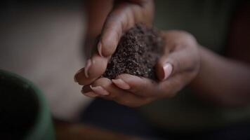 Hands Holding Rich and NutrientDense Soil for the Purpose of Sustainable Gardening Practices video