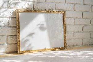 Photo frames on floor over white brick wall