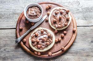 Bun slices with chocolate cream and nuts photo