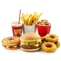 A variety of fast food and junk food items displayed together on a clean white background. The assortment includes a juicy cheeseburger with melted cheese and fresh toppings. photo