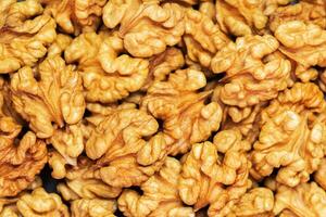 Walnuts background. Kernels walnuts. Top view. Vegetarian or healthy food photo
