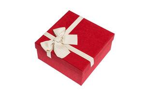 Red gift box with gold ribbon and bow isolated on white background photo