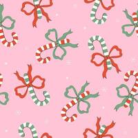 Seamless pattern with sweet canes with bows. graphics. vector