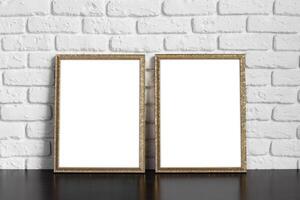 Blank picture frame against brick wall with copy space photo