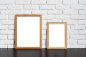 Blank picture frame against brick wall with copy space photo