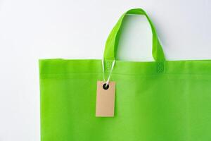 Eco bag for shopping with blank tag on white background photo