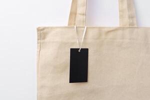 Eco bag for shopping with blank tag on white background photo