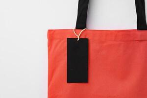Eco bag for shopping with blank tag on white background photo