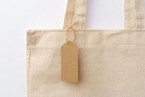 Eco bag for shopping with blank tag on white background photo