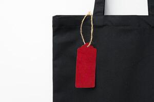 Eco bag for shopping with blank tag on white background photo