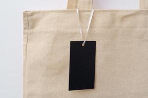 Eco bag for shopping with blank tag on white background photo