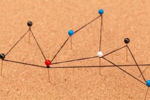 pins connected creating a network photo