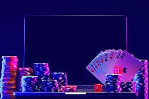 Laptop With Playing Cards and Poker Chips on a Green Table photo
