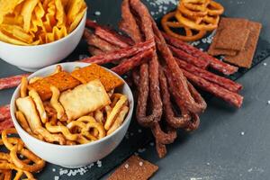 Assortment of beer snacks close up on counter photo