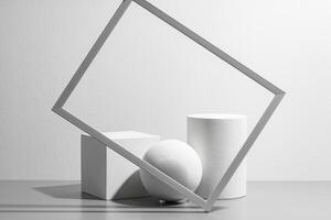 Abstract composition featuring three white geometric shapes in a minimalist interior setting photo