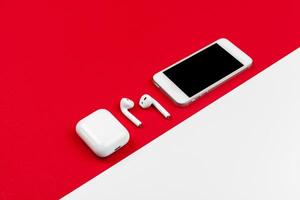 Mock up with copy space with smartphone on bright red background photo