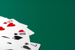 Playing cards on paper background close up photo
