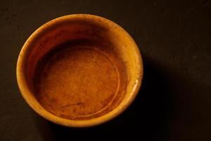 Empty bowl on dark background with copy space photo