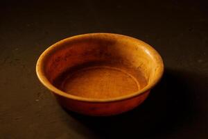 Empty bowl on dark background with copy space photo