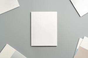 Empty White Sheet of Paper Positioned at an Angle on Light Gray Surface photo