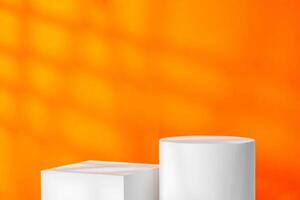 White geometric shapes on a vibrant orange background with soft shadows in a well-lit indoor setting photo