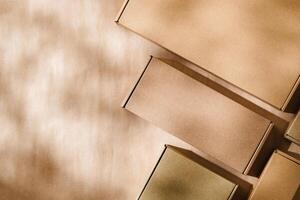 Brown cardboard boxes arranged on a neutral background in a warehouse setting during daylight hours photo