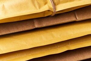 Close up shot of stack of padded mailing envelopes photo