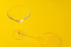 Empty transparent glass on a color background with copyspace. photo