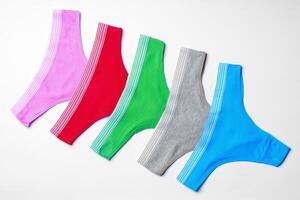 Set of cotton string women's panties on white background photo