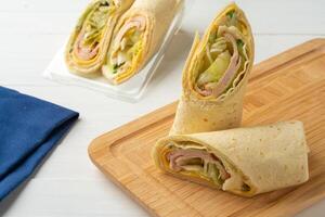 Fresh tortilla wraps with chicken and fresh vegetables photo