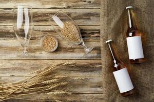 A bottle of beer and grain. Top view. Free space for text. photo