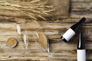 A bottle of beer and grain. Top view. Free space for text. photo