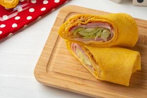 Fresh tortilla wraps with chicken and fresh vegetables photo