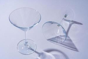 Two empty wine glass on gray background top view photo