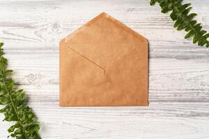 envelope and blank paper card with copy space mock up. photo