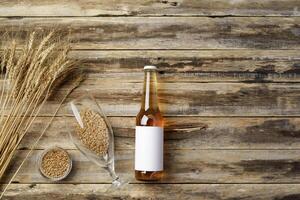A bottle of beer and grain. Top view. Free space for text. photo