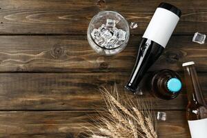 A bottle of beer and grain. Top view. Free space for text. photo