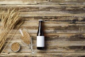 A bottle of beer and grain. Top view. Free space for text. photo