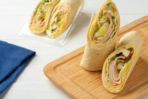 Fresh tortilla wraps with chicken and fresh vegetables photo