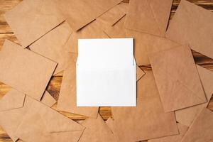 Stack of envelopes on working desk top view. Business mail photo