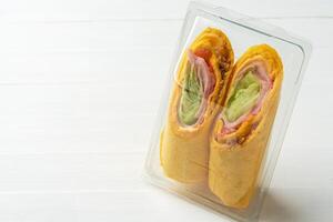 Fresh tortilla wraps with chicken and fresh vegetables photo