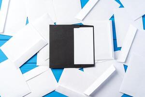 Stack of envelopes on working desk top view. Business mail photo