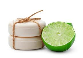 Handmade soap with lime on a white background photo