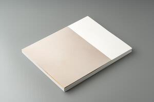 A minimalistic design showcasing an open book resting on a gray surface in soft lighting photo